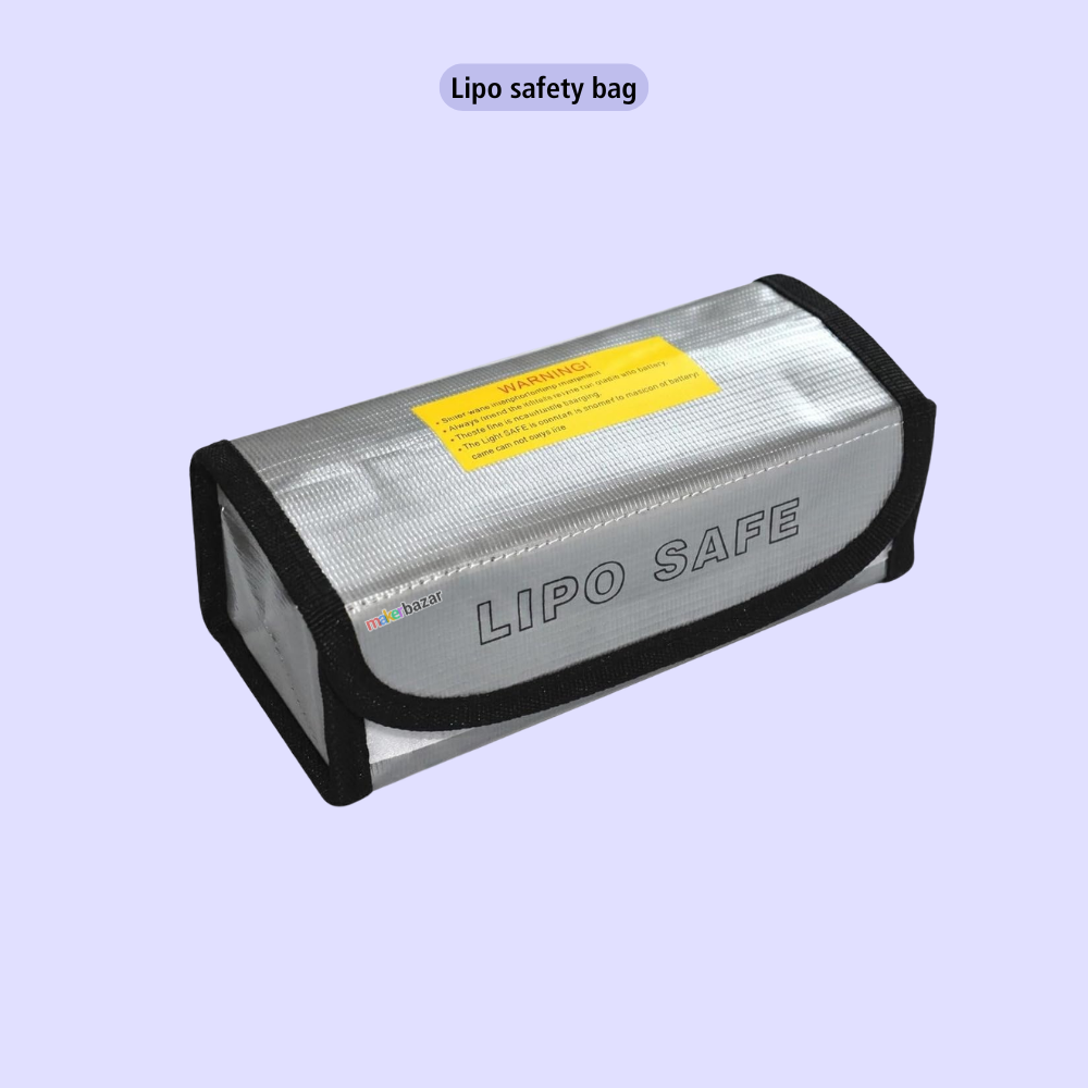 A silver and black insulated safety bag labeled 'LIPO SAFE' with a yellow warning sticker, shown on a light lavender background with the text 'Lipo safety bag' above it.