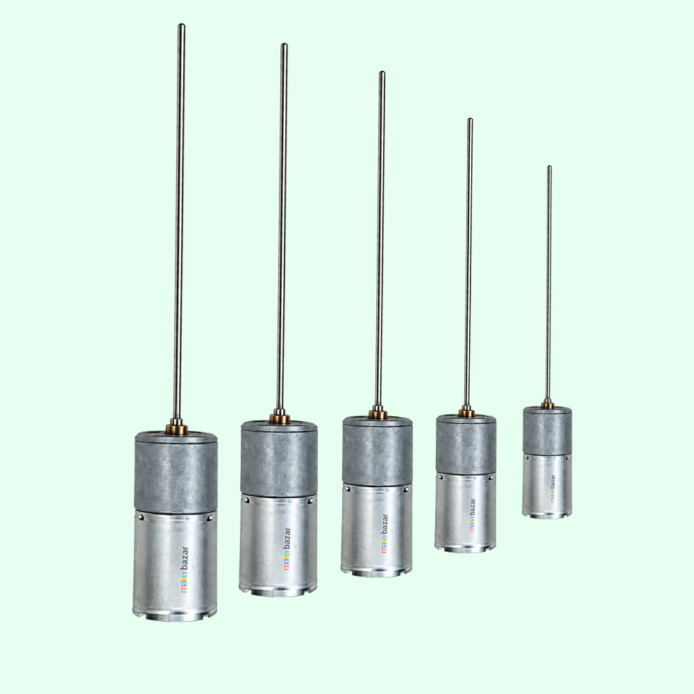 Five cylindrical metal devices with long thin antennas, arranged in descending size order against a pale mint green background. The devices have a metallic silver body with a darker gray upper section and small multicolor branding text near the base.