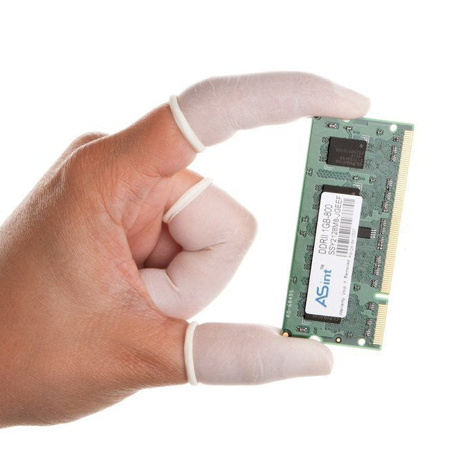 A hand wearing white finger guards holds a green ASMMI DDR RAM memory module against a plain white background.