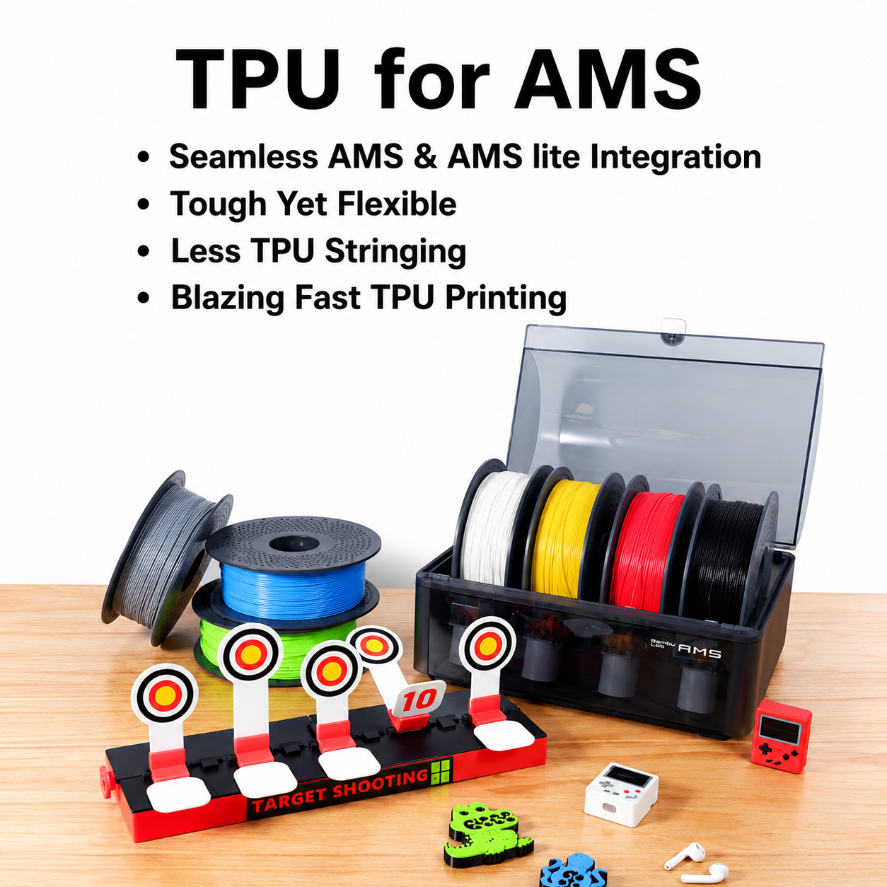 TPU filament spools and a 3D printing kit displayed on a wooden surface with promotional text at the top. The kit includes multiple spools of TPU filament in white, yellow, red, black, blue, and green, a black storage case, target practice targets, a small red 3D printer, a green toy, and other accessories.